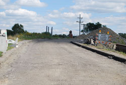 The final photos show the demolition in October 2014 and the new steel beams being placed in March 2015.