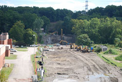 The final photos show the demolition in October 2014 and the new steel beams being placed in March 2015.