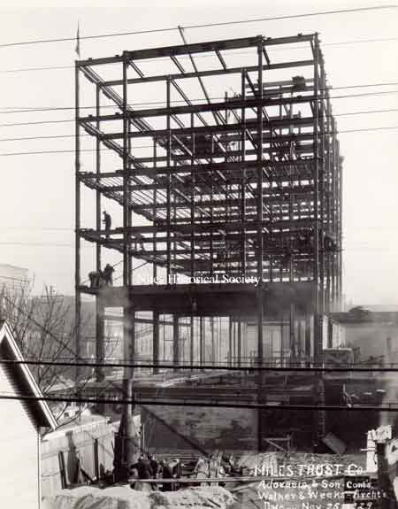 A series of photographs documenting the various stages of the construction of the Niles Trust Company Building.