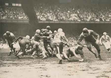 1936 photograph featuring Phil Ragazzo bearing down on running back.