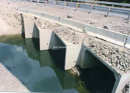 The temporary runaround was constructed over large concrete culverts that allowed the flow of Meander Creek to be continue unobstructed.