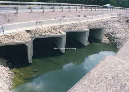 The temporary runaround was constructed over large concrete culverts that allowed the flow of Meander Creek to be continue unobstructed.