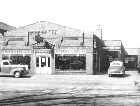 The DeJute Building at 236 North Main Street was built in 1928. A Desoto-Plymouth dealership was then located here. Later, C.H. Stiver sold Chevrolets at this location, then moved across the street.