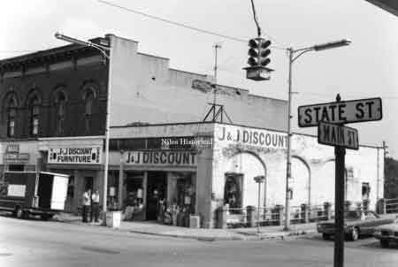 Photo taken of J & J Discount Store on the southeast corner of Main and State Streets in downtown Niles before urban renewal. 